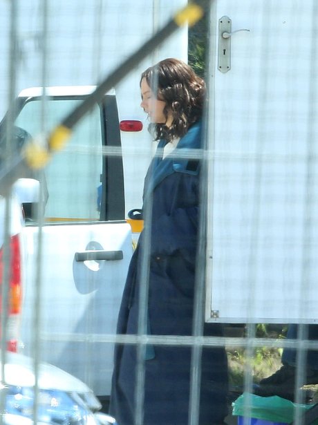 Taylor Swift with brown hair on set of 'The Giver'