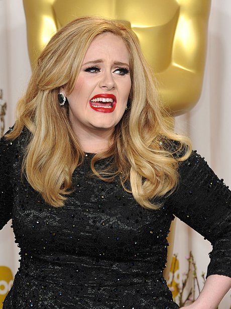 Adele picks up her award