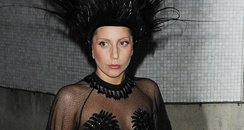 Lady Gaga wearing a peacock hat