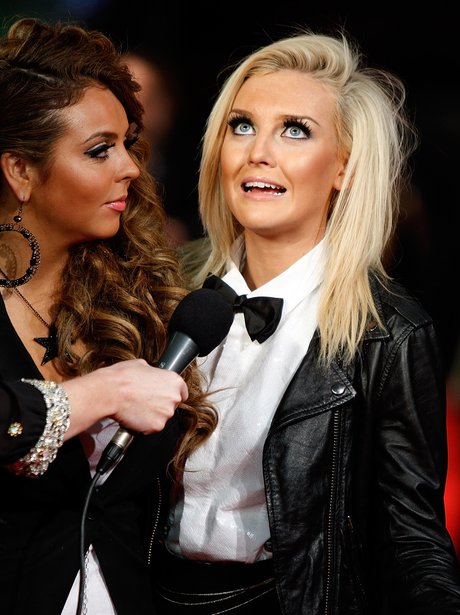 Perrie Edwards gets interviewed by her bandmate