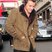 Image 9: Harry Styles shows off his ponytail in London