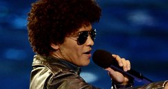 Bruno Mars accepts the 'Best Song' award at the MT