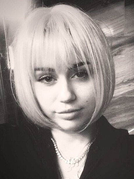 Miley Cyrus wearing a wig