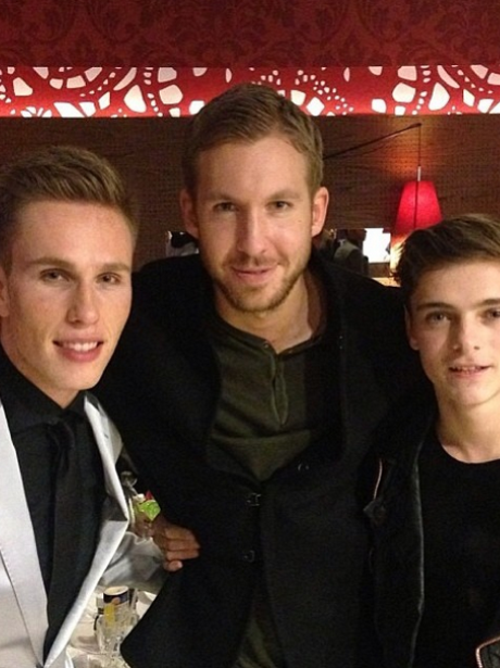 Martin Garrix poses for a picture with Calvin Harris and Nicki Romero