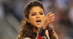  Selena Gomez performs during the halftime of a Th