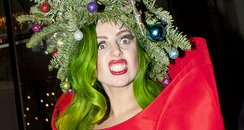 Lady Gaga wearing a Christmas tree hat