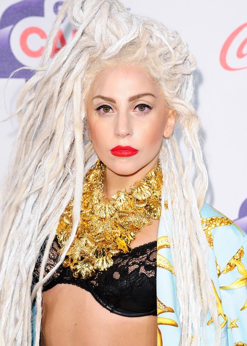 Lady Gaga arriving for the Jingle Bell Ball in a black bra suit and blonde dreadlocks