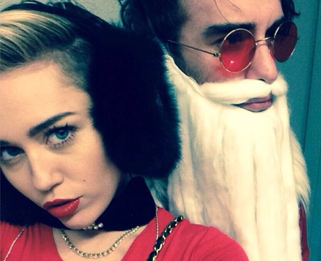 Miley Cyrus poses with her own Bad Santa