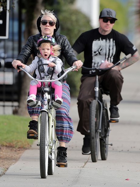 Pink and Willow riding a bike