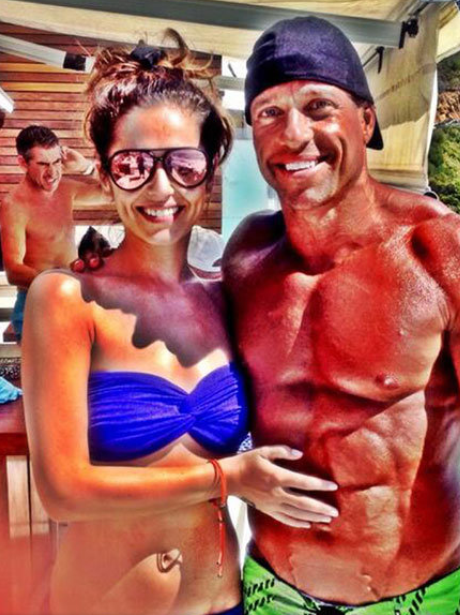 Cheryl Cole poses with a muscular man out in Cape Town