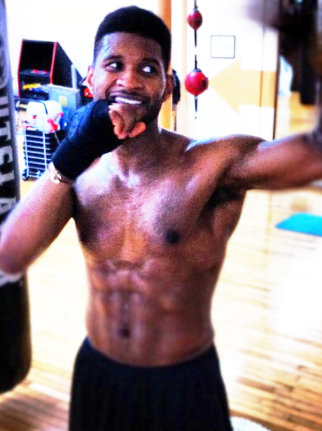 Usher practices his boxing moves in the gym