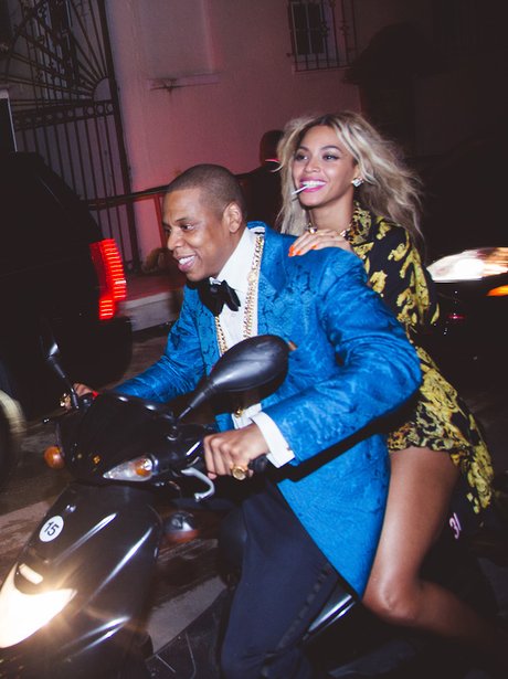 Beyonce and Jay Z riding a motorbike
