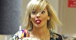 Rita Ora sticking her tongue out at the airport