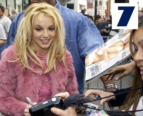 Britney Spears poses with some of her fans