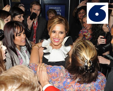 Cheryl Cole poses with some of her fans