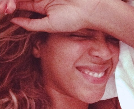 beyonce smiling in bed