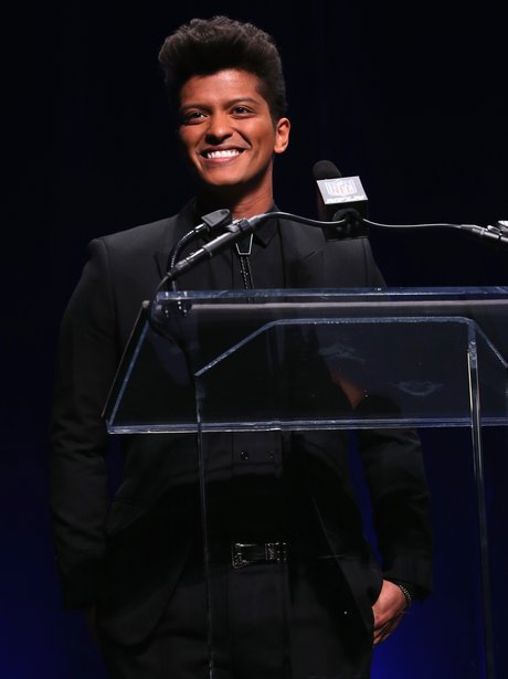 Bruno Mars speaking on stage
