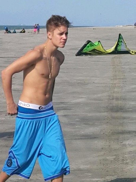 Justin Bieber topless on the beach