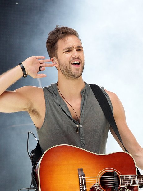 Lawson's ANdy Brown with V neck t shirt on stage