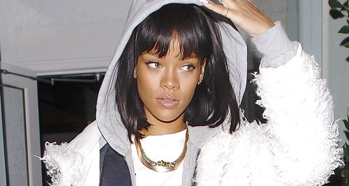 Rihanna wearing a white tracksuit