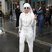 Image 10: Lady Gaga wearing a white suit wiht a long whiite 