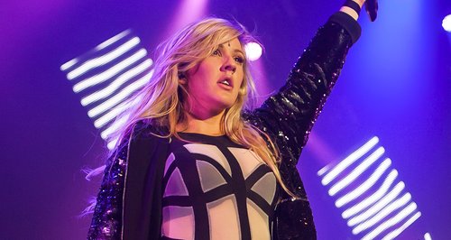Ellie Goulding wearing a bodysuit on stage