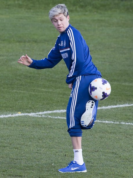 Niall Horan playing football