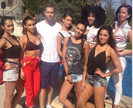 Calvin Harris with women by a pool