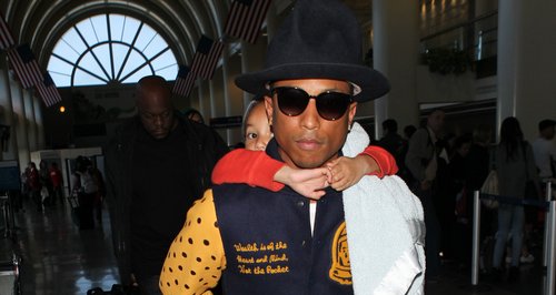 Pharrell Williams and Child Piggy Back