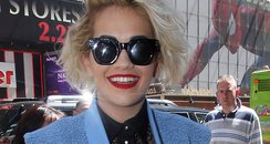 Rita Ora wears leather shorts and sunglasses 