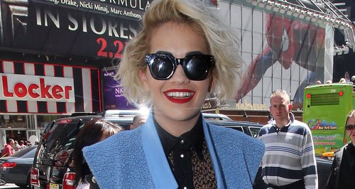 Rita Ora wears leather shorts and sunglasses 