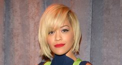 Rita Ora wearing a stripey dress