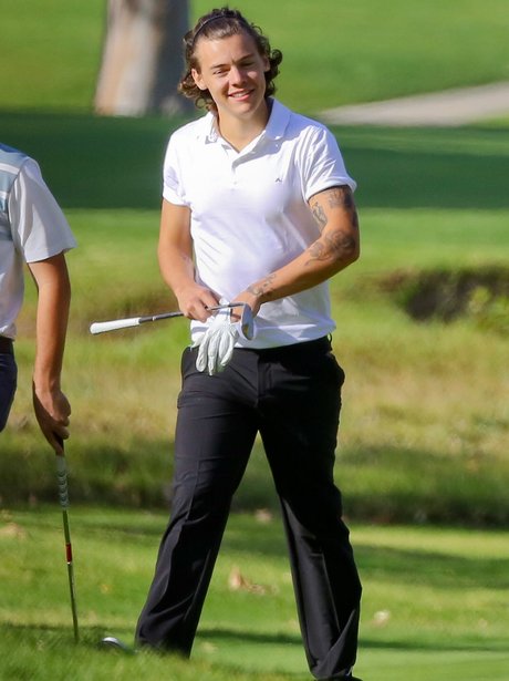 Harry Styles playing golf