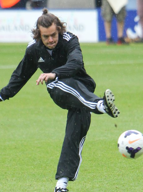 Harry Styles playing football