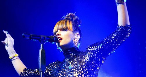 Lily Allen performs in a catsuit