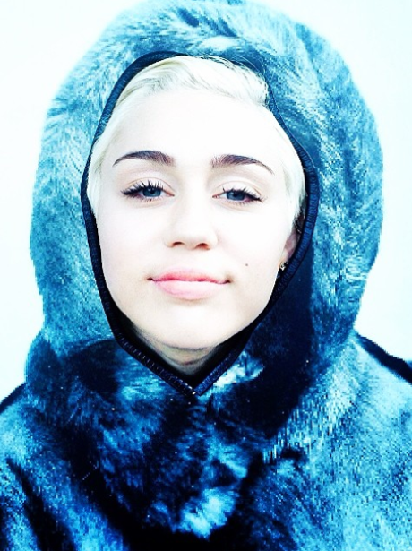 Miley Cyrus wearing a fur hood