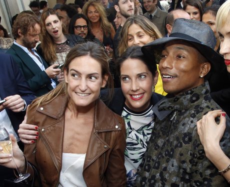 Pharrell posing with fans