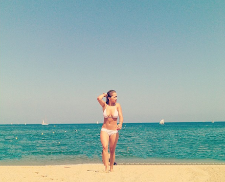 Rita Ora in a white bikini