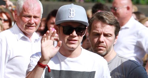 Niall Horan waving at fans