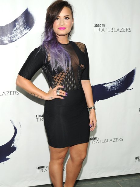 Demi Lovato wearing a tight black dress