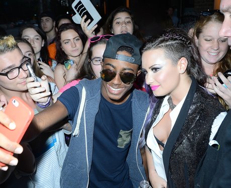 Demi Lovato takes a selfie with fans