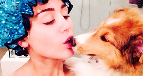 Miley Cyrus with her dog in the shower