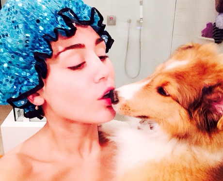 Miley Cyrus with her dog in the shower