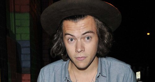 Harry Styles wears a jersey for openly gay NFL player Michael Sam