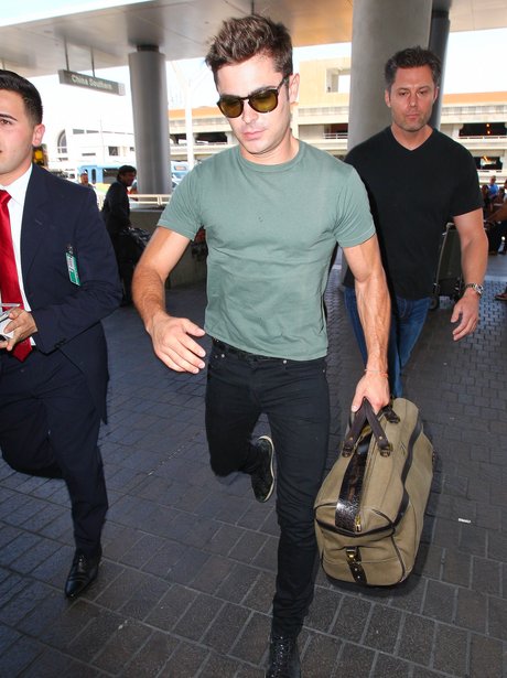 Zac Efron seen walking through LAX