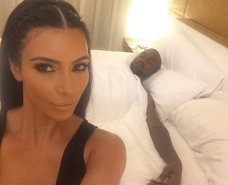 Kim Kardashian West seflie with Kanye sleeping