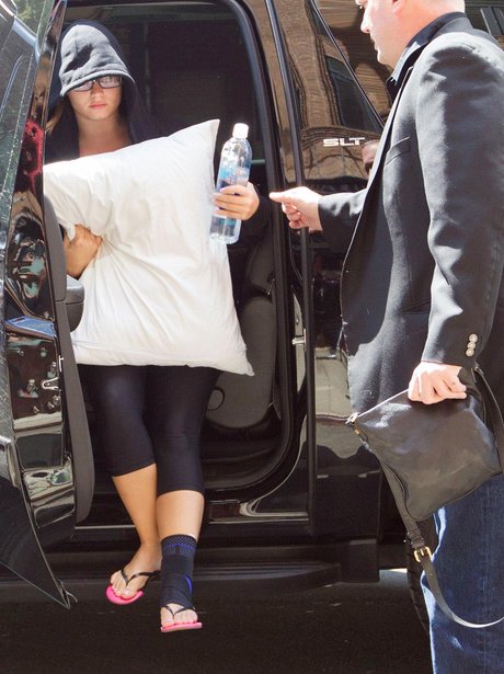 Demi Lovato with an injured foot