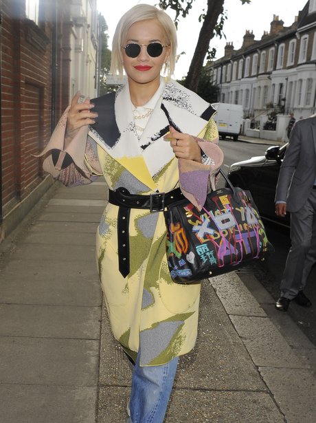 Rita Ora wearing a patterned coat