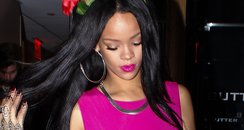 Rihanna wearing a bright pink dress