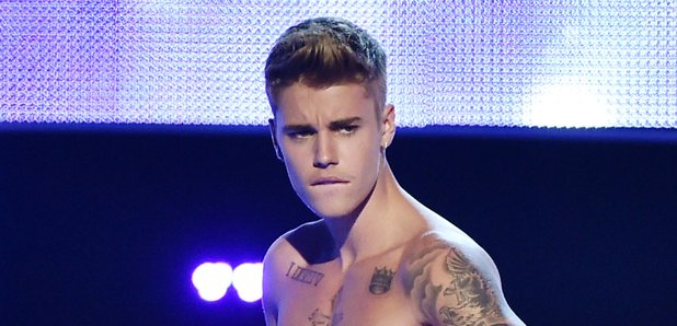 Justin Bieber strips on stage at Fashion Rocks 